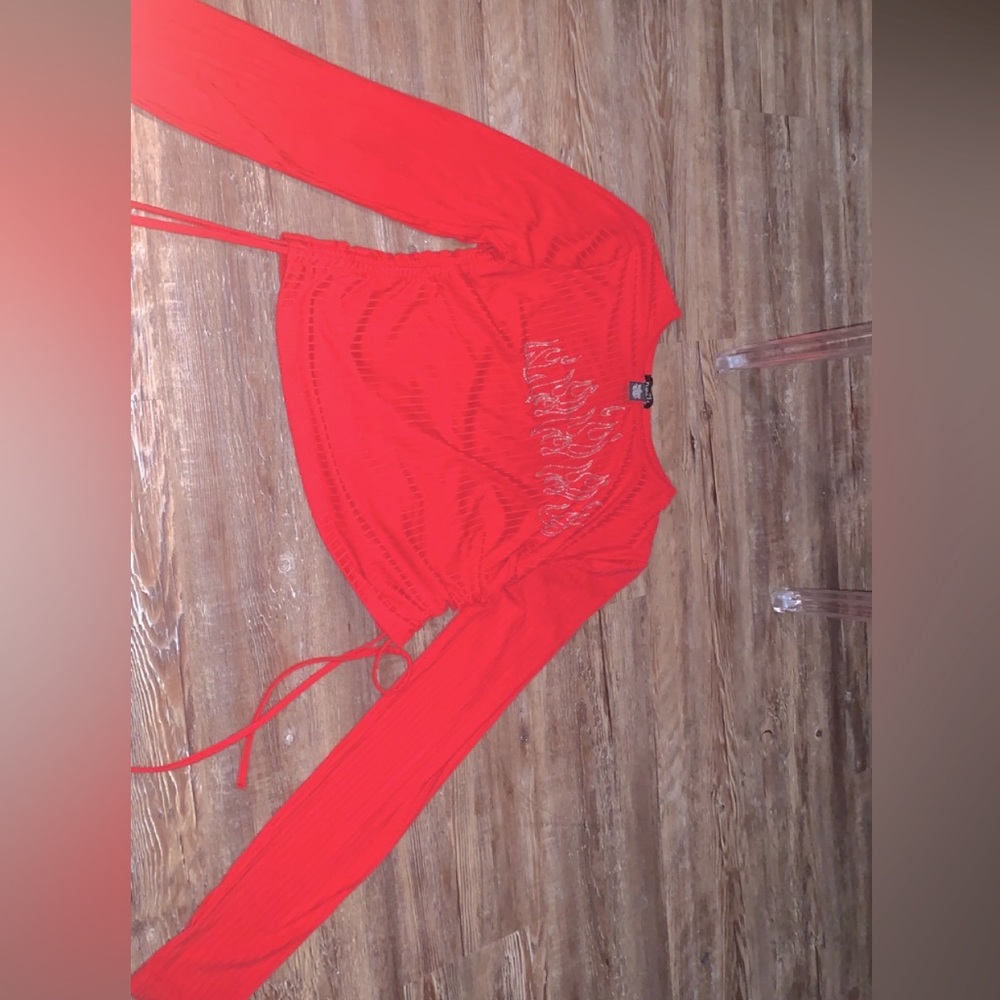 This a red long sleeve crop top. Size :xL  the shirt is from rule 21.
